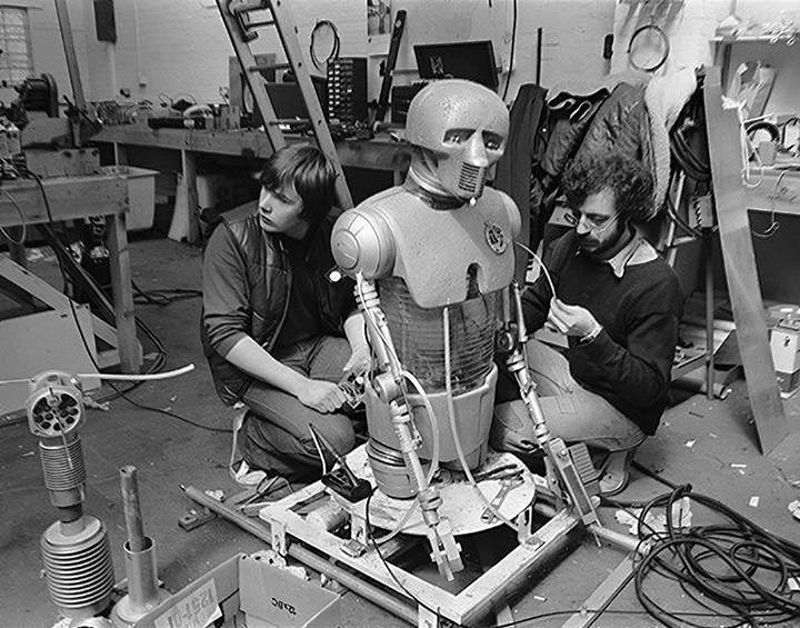 Digby Milner and Dennis Lowe work on the medical droid